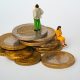 UKDS blog the biggest credit myths debunked characters standing on coins