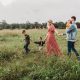 how to save money during school holidays family walking through field